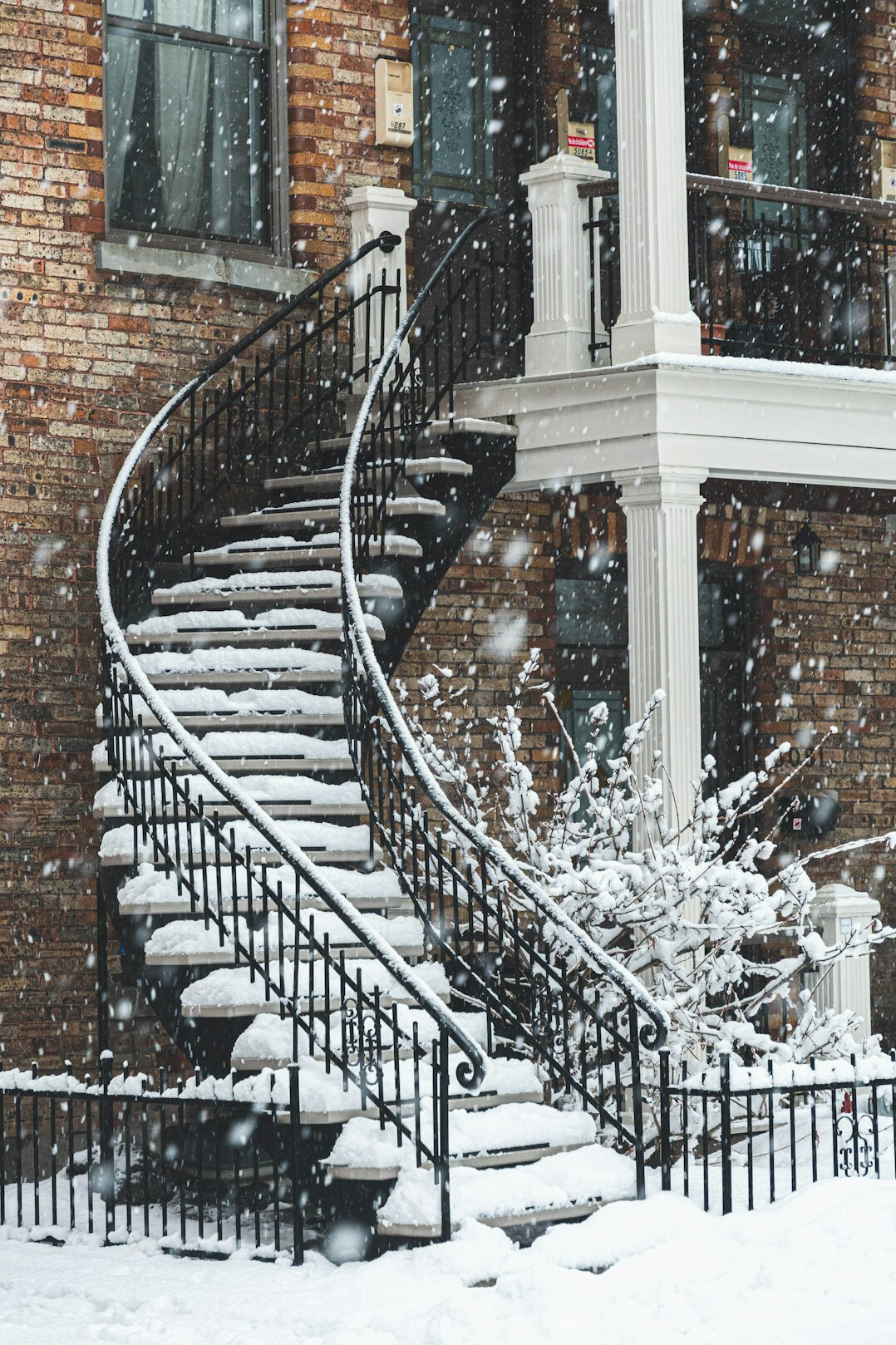 Classic outdoor spiral staircases on a Montreal triplex street